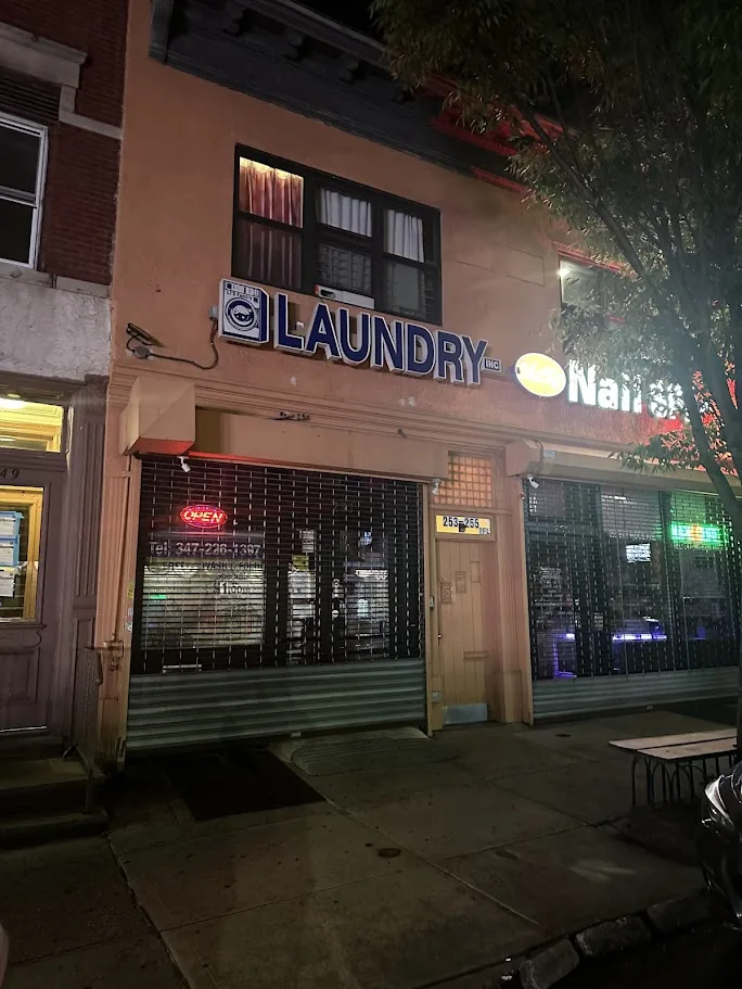 Li's Family Laundry storefront at night
