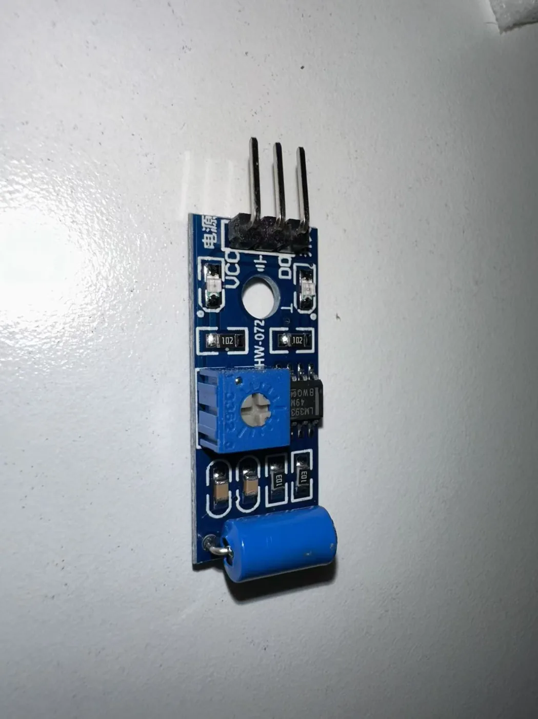 An ESP32 board, an SW-420 vibration sensor, and jumper wires