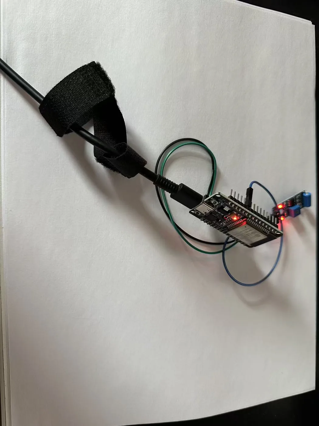 The sensor wired to the ESP32 with three jumper wires