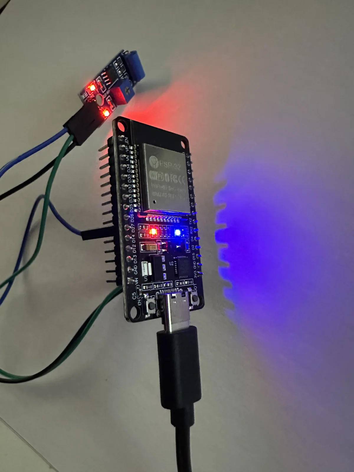 The ESP32's blue LED lit — the moment it detected the machine running