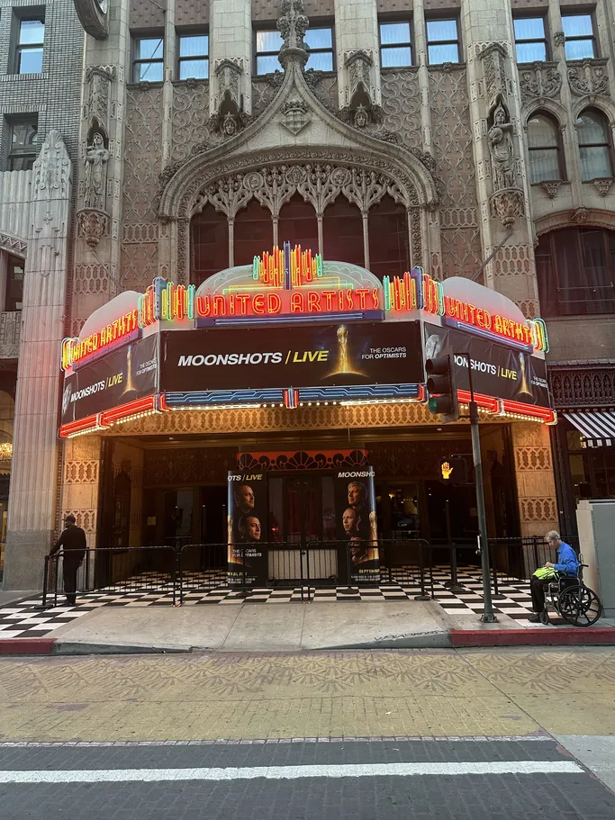 The United Theater marquee in downtown Los Angeles reading MOONSHOTS LIVE